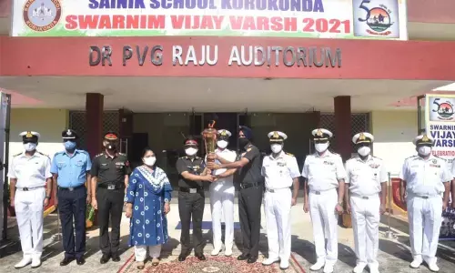Sainik School Principal Col Arun Kulkarni along with Collector A Surya Kumari and other officials receiving the Victory Flame in Sainik school on Saturday