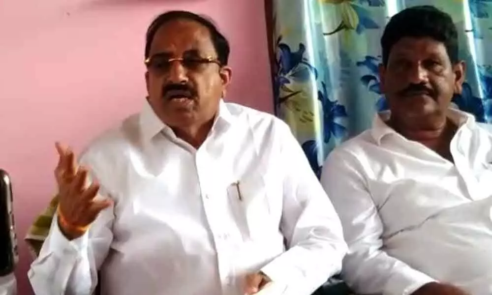 Former minister Tummala Nageswara Rao speaking to media persons in Chennaram village in Nelakondapalli mandal on Sunday
