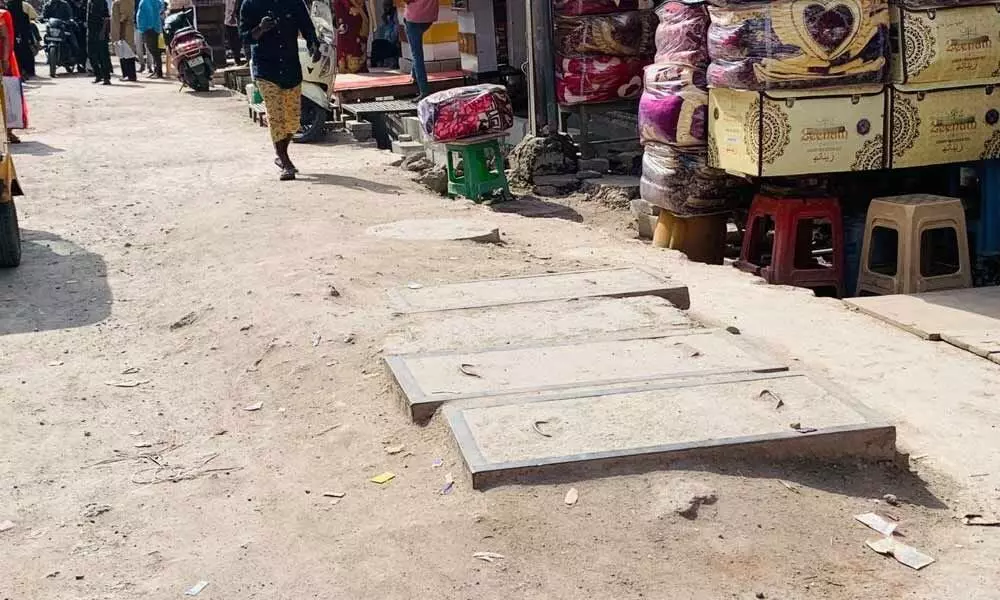 Broken pavements greet visitors to Laad Bazar