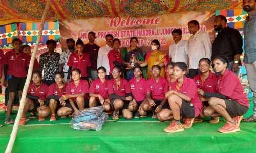 MLC Kalpalatha and Mayor Bhagya Lakshmi distributing trophy to Vizag Handball Girls team