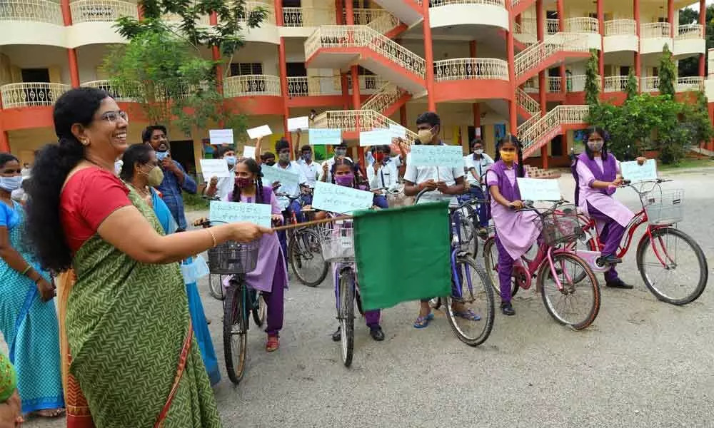 Principal Secretary of Women and Child Welfare department A R Anuradha flagging off a bicycle rally of students at MGM High School in Tirupati on Monday