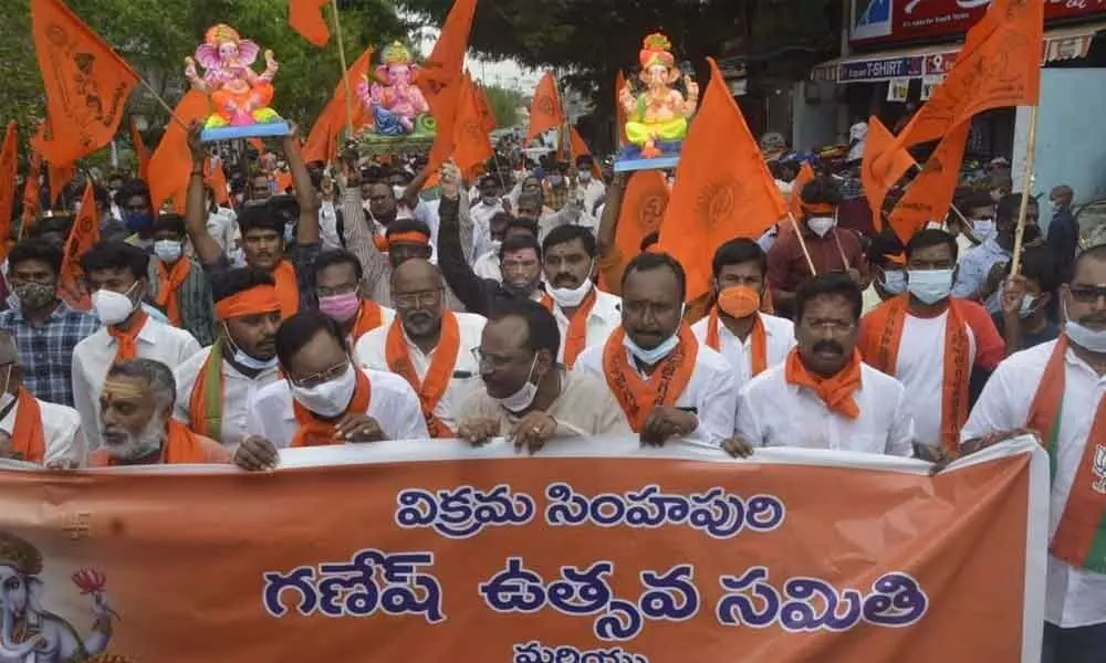 BJP leaders taking out a rally demanding permission for Ganesh festival celebrations at public places in Nellore on Monday