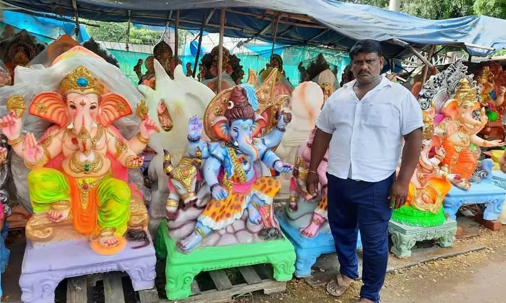 Idol trader Varalu selling Ganesh idols in Vijayawada on Tuesday