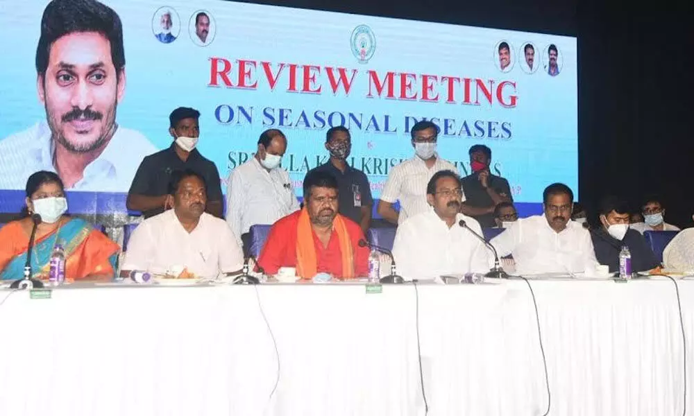 Health Minister Kali Krishna Srinivas addressing the review meeting at VMRDA Children’s Arena in Visakhapatnam on Tuesday