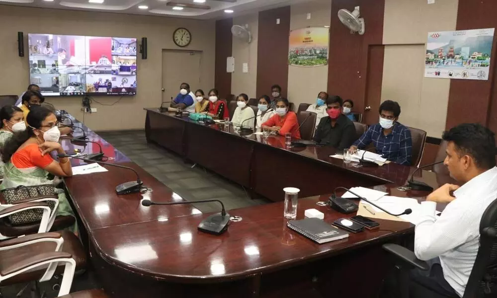 Municipal Commissioner P S Girisha holds a review meeting with PHC officials to check the spread of Covid cases, at  Municipal Office in Tirupati on Tuesday.