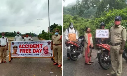 Police personnel creating awareness about precautions and traffic rules on highways in Kakinada on Tuesday