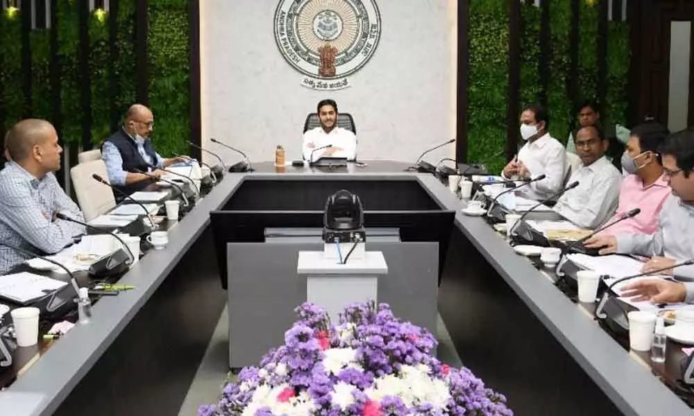 Chief Minister Y S Jagan Mohan Reddy holding a review meeting on prevailing Covid situation and vaccination at his camp office in Tadepalli on Wednesday