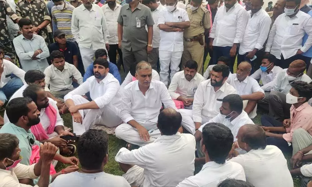 Finance Minister  T Harish Rao speaking to villagers at Rachapalli in Illandakunta mandal in Karimnagar district on Wednesday