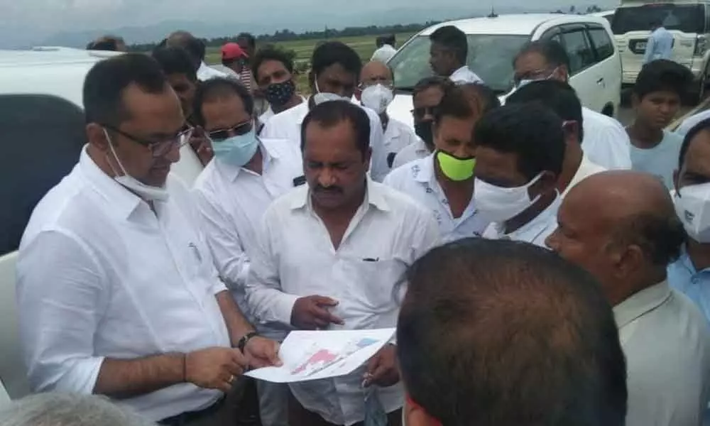 District Collector Srikesh B Lathkar examining SACON report and Beela land map at Beela in Sompeta mandal on Wednesday