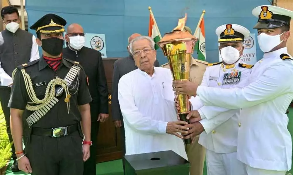 Governor Biswa Bhusan Harichandan receiving ‘Victory Flame’ at the Raj Bhavan in Vijayawada on Wednesday