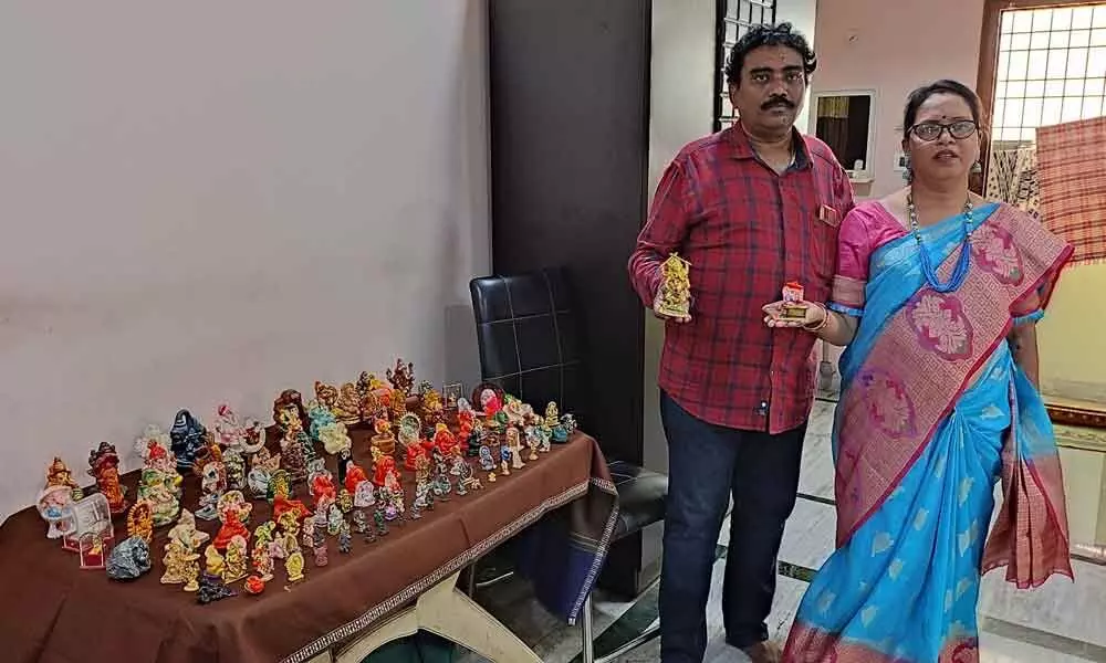 A couple with a collection of Ganesh idols in Visakhapatnam