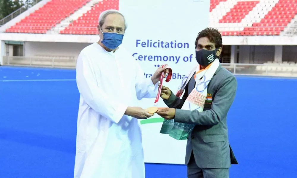 Odisha CM Naveen Patnaik on Friday felicitated Tokyo Paralympics gold medallist shuttler Pramod Bhagat with a cash award of Rs 6 crore at the Kalinga Hockey Stadium