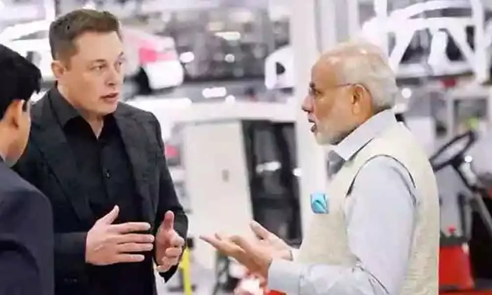 File Photo: Tesla CEO Elon Musk and Prime Minister Narendra Modi discussing Tesla’s developments in battery technology.