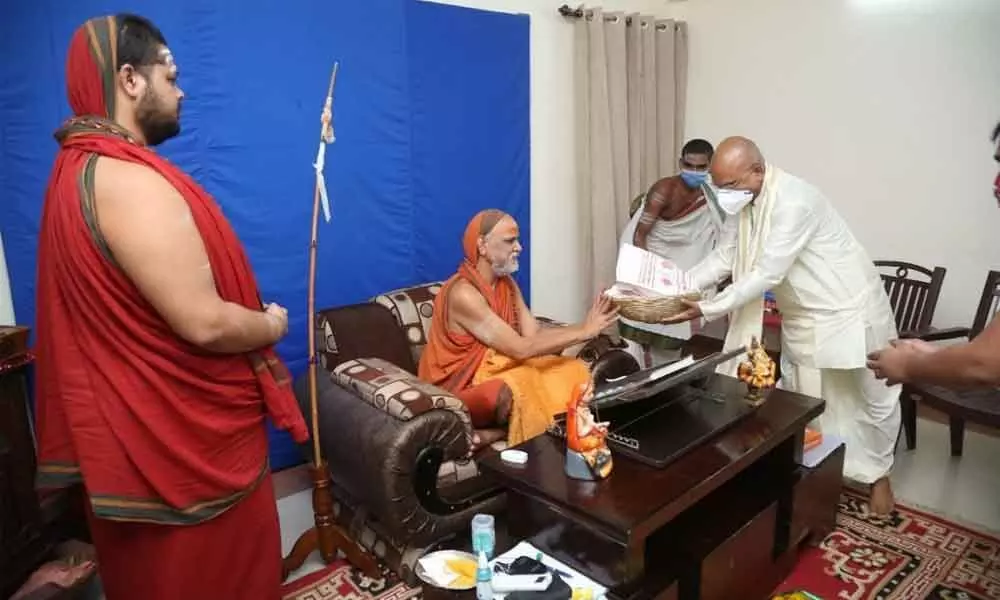 TTD EO K S Jawahar Reddy having darshan of Visakha Sarada Peetham seer Sri Swarupananda Saraswati Swamiji in Rishikesh in Uttarakhand on Saturday. Sri Swatmanandendra Saraswathi Swamiji is also seen.