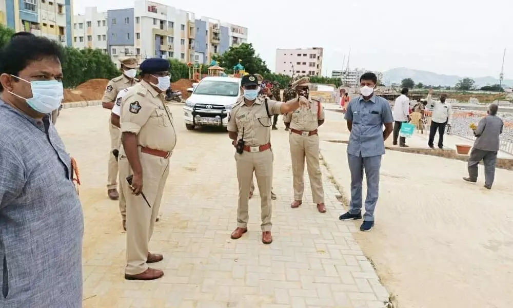 Urban SP Ch Venkata Appala Naidu issuing directions to the officials on taking safety measures at Chennaiah Gunta Cheruruv, the venue for immersion of Ganesh idols, in Tirupati on Sunday