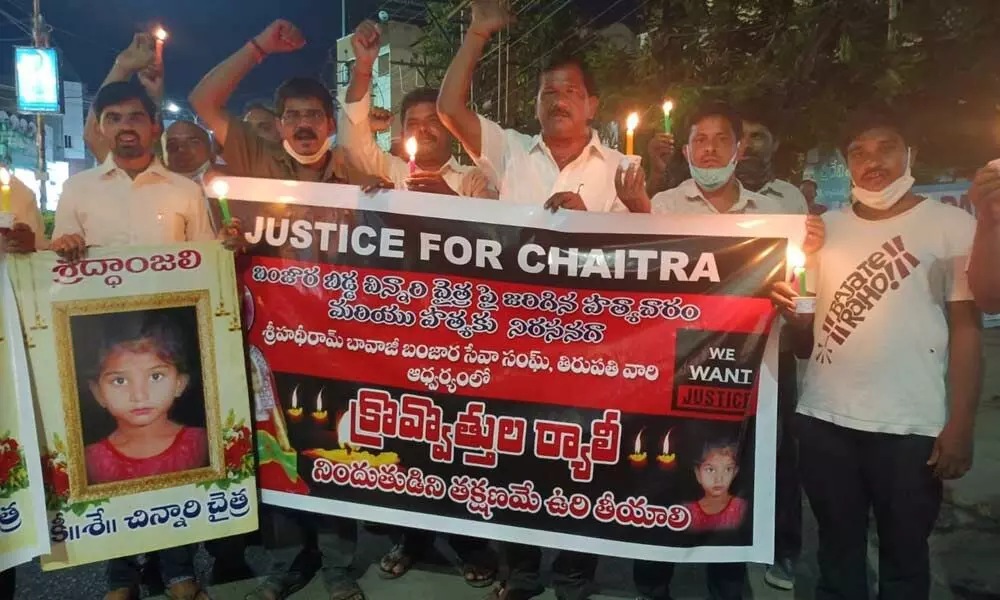 SHBBSS leaders holding a candle rally demanding that the Telangana government  hang the culprit responsible for rape and murder of a 6-year-old girl in Hyderabad, in Tirupati on Sunday.