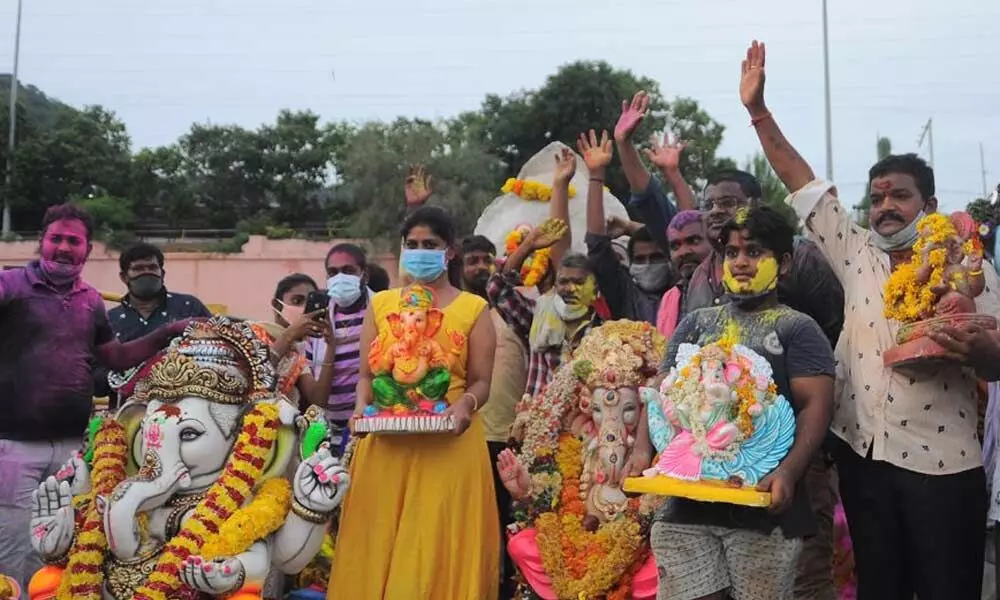 Ganesh idols being immersed into Krishna River in Vijayawada on Sunday