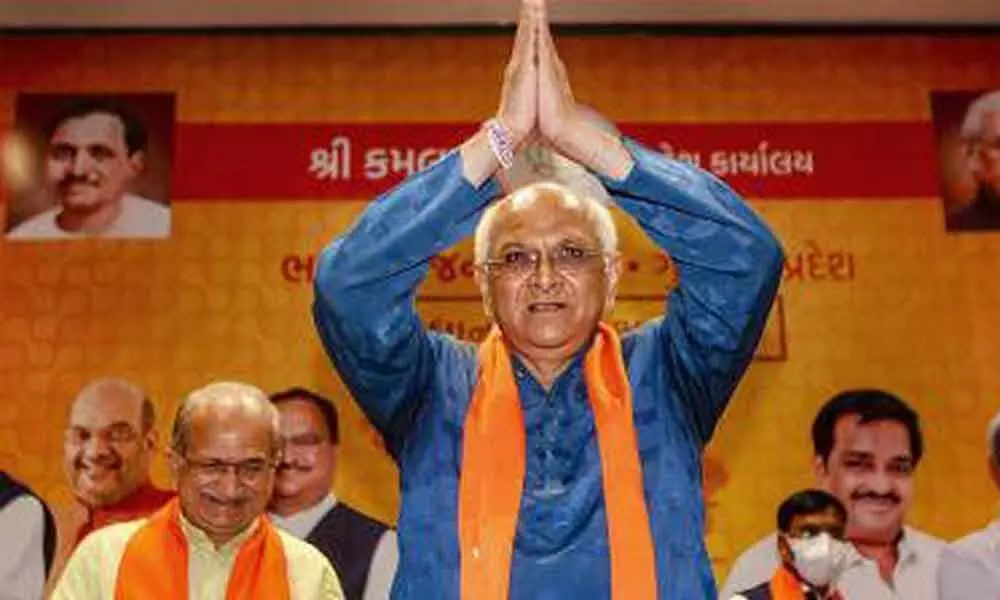 BJP leader Bhupendra Patel acknowledges the greeting after being elected as new Gujarat Chief Minister