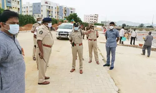 Urban SP Ch Venkata Appala Naidu issuing directions to the officials on taking safety measures at Chennaiah Gunta Cheruruv, the venue for immersion of Ganesh idols, in Tirupati on Sunday