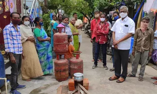 CPM leaders are apprising people how the Central govern is fleecing with exorbitant fuel prices, in Vijayawada on Sunday