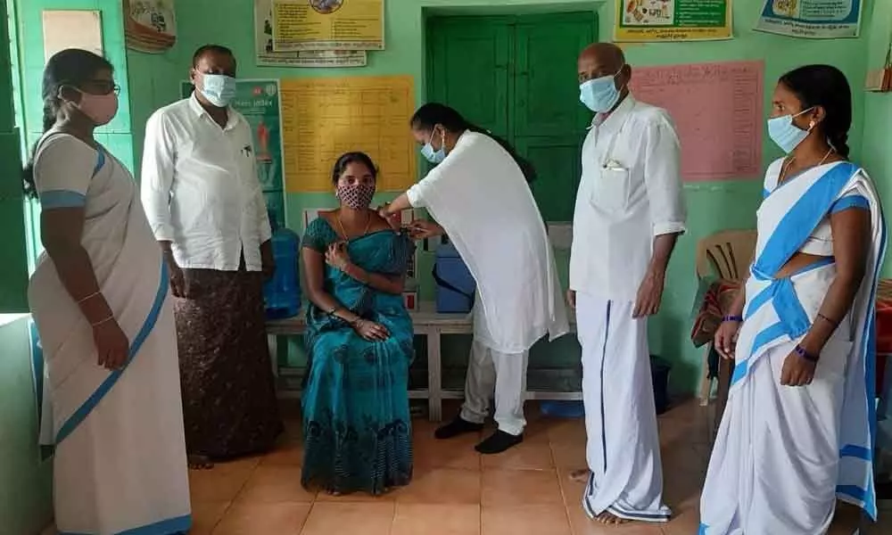 Covid vaccine being administered to a woman at a PHC in Chittoor district on Sunday.