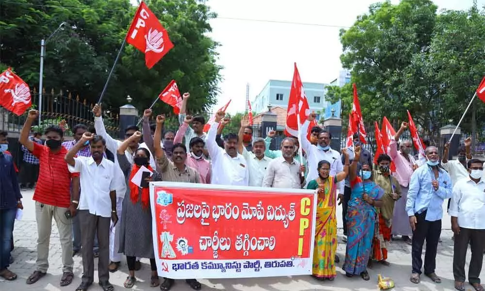 CPI leaders staging protest against true- up charges at APSPDCL office in Tirupati on Monday