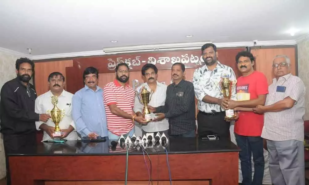 VJF members unveiling VJF-CMR Inter Media trophy in Visakhapatnam on Monday