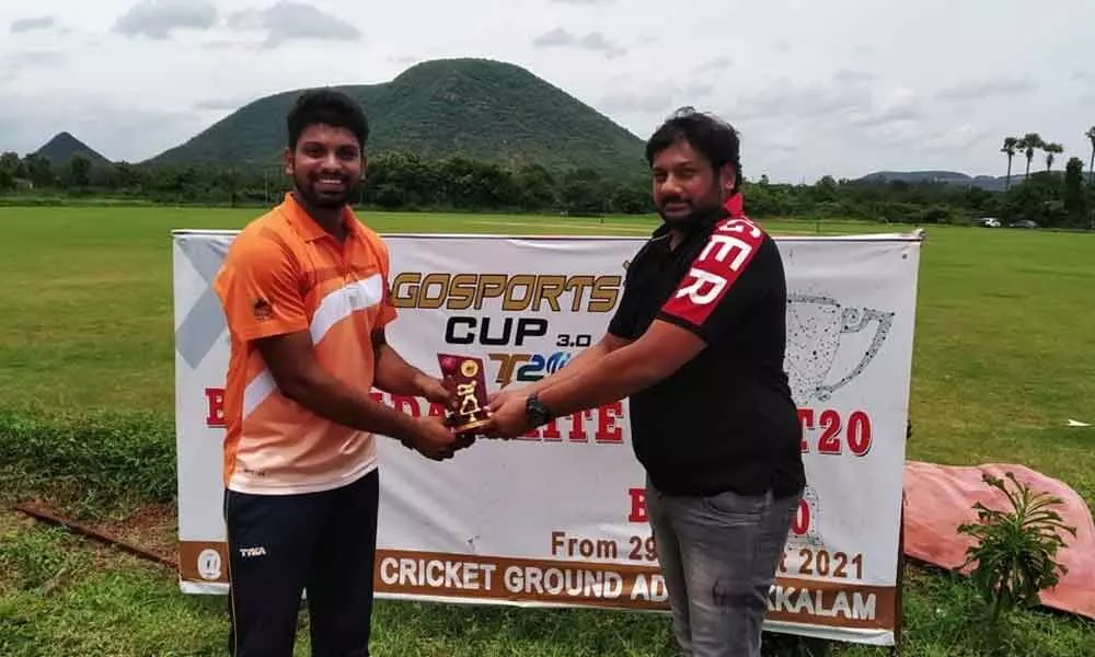 Allrounder Ujjawal of Kushi Warriors receiving Man of the Match award from Jwali Kumar  of Gosports Committee in Vijayawada on Monday