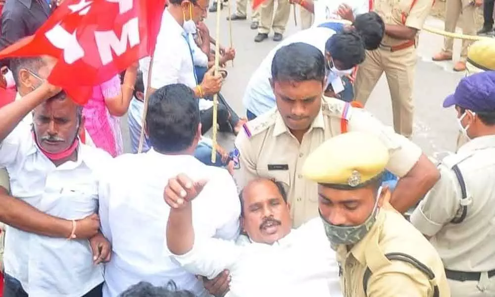 Police arresting CPM leaders during a protest programme in Khammam on Monday.