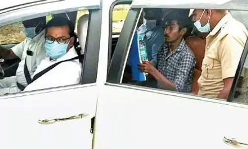 Collector Amar Kushwaha dropping a NEET aspirant at the exam centre in Yelagiri Hills on Sunday | Express