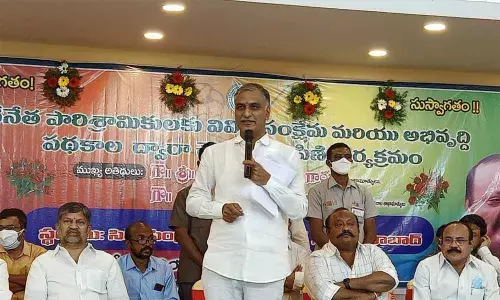 Minister T Harish Rao speaking in a meeting at Huzurabad in Karimnagar district on Monday