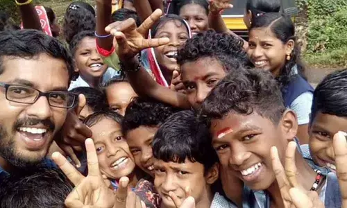 Dr KP Nitheesh Kumar with tribal students.