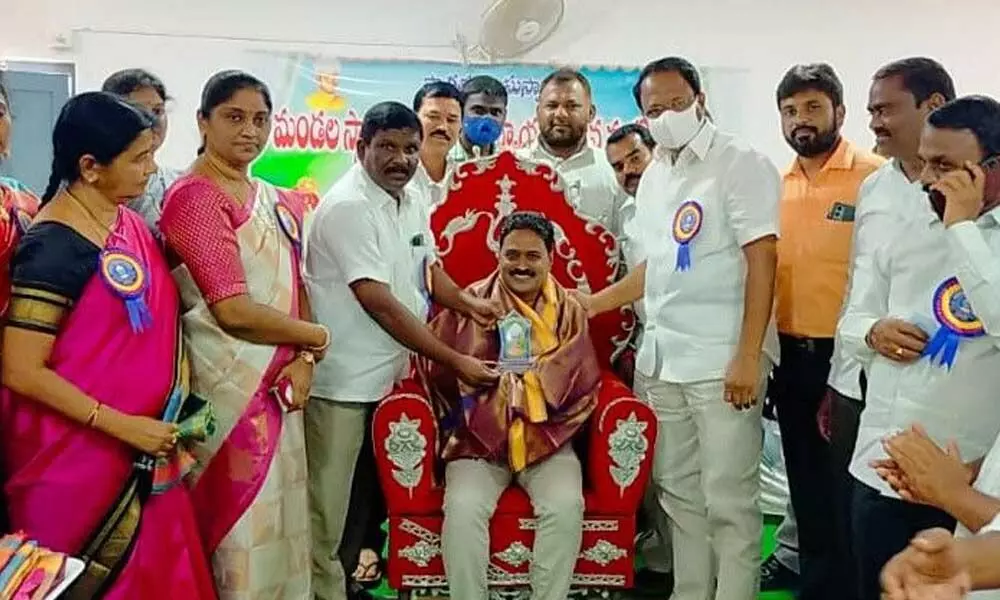 Jadcherla MLA Laxma Reddy felicitating a teacher on Wednesday