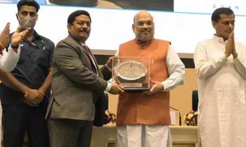 Rajkiran Rai G receiving award from Home Minister Amit Shah