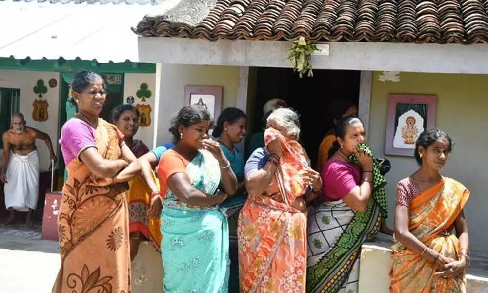 Relatives and neighbours are seen near the house of NEET aspirant T. Soundariya, who was found dead at her house, near Katpadi in Vellore on September 15, 2021.   | Photo Credit: Venkatachalapathy C