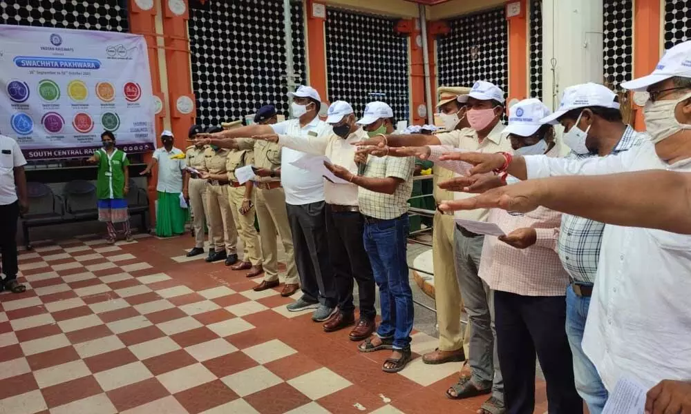 ADRM K Suryanarayana, Station Director K Satyanarayana and others taking Swachhata pledge at Tirupati station on Thursday
