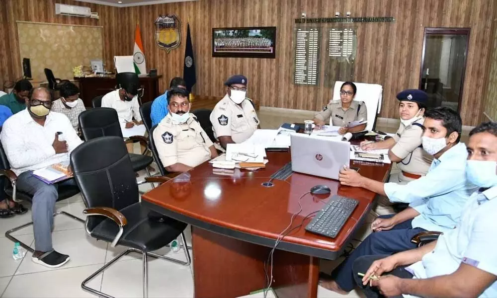 SP Malika Garg and officers conducting review meeting from the district police office in Ongole on Thursday