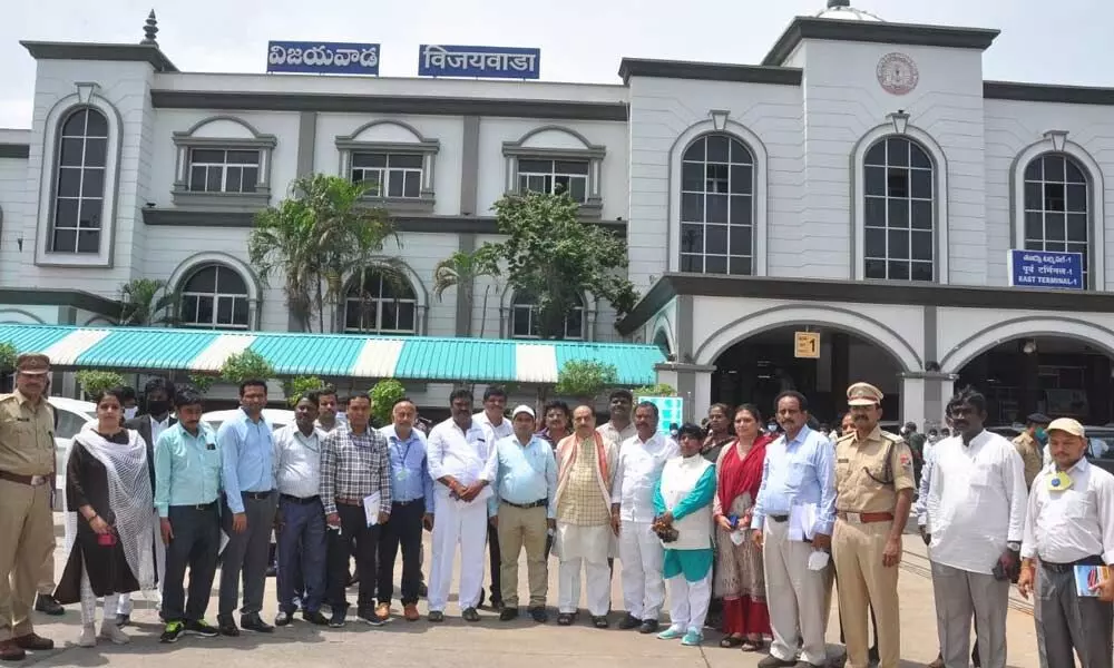 Passenger Services Committee members and Railway officials in front of the Vijayawada Railway Station on Wednesday
