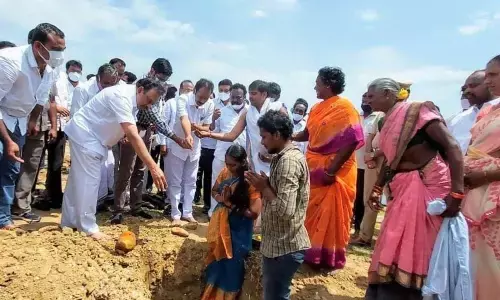 MP Magunta Srinivasulu Reddy and PDCC Bank chairman Madasi Venkaiah laying foundation to houses under the Mega Housing Mela programme at Kondapi on Thursday