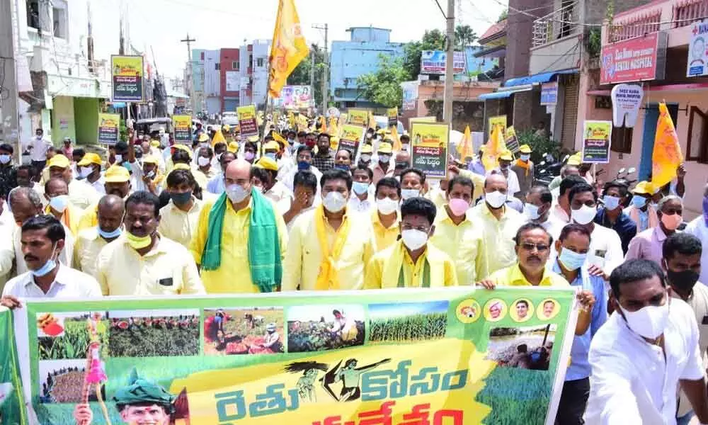 TDP leader RVSKK Rangarao and other party activists participating in a rally in Bobbili on Friday over farmers’ issues
