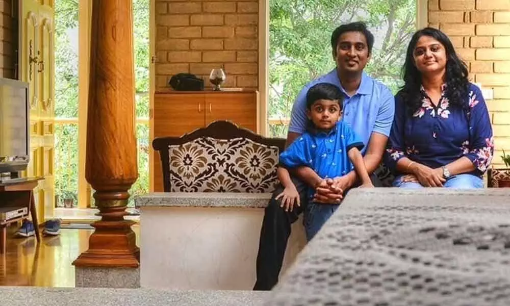 Pradeep Krishnamurthy from Bengaluru built a sustainable house from natural materials like mud and reclaimed wood with breathing walls. It uses biogas three hours a day and also has a terrace garden.