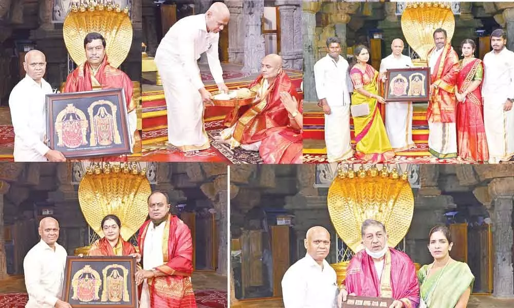 TTD Additional Executive Officer A V Dharma Reddy presenting laminated photos of Lord to new members Dr Parthasaradhi Reddy, N Srinivasan,  B Madhusudhan Yadav,   Sanath Kumar and V Prasanthi Reddy, who were administered oath in Tirumala on saturday