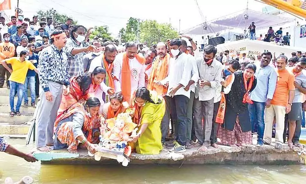 Ganesh idol being immersed at Vinayaka Ghat