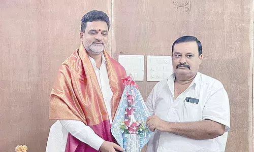 Muslim Employees Association leader Mohammad Mujahid Hussain felicitating BC Commission Chairman V Krishna Mohan Rao at the commission office in Hyderabad on Saturday