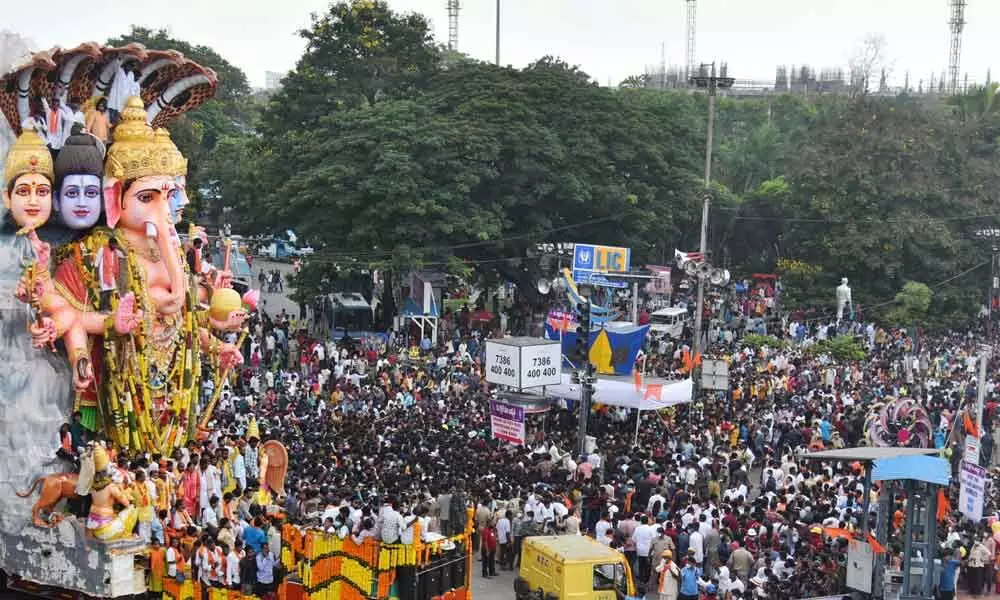 Devotees in large numbers during the immersion procession of Khairatabad Ganesh idol on the last day of Ganesh Chaturthi festival in Hyderabad on Sunday