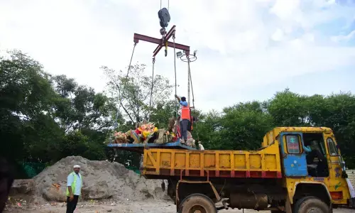 GHMC  sanitation wing takes up the major task of clearing the artificial ponds filled with idols on Sunday                                       photo: Srinivas Setty