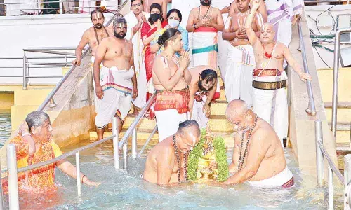 Priests performing Chakrasnanam as part of the Ananta Padmanabha Vratam festivities at Tirumala on Sunday