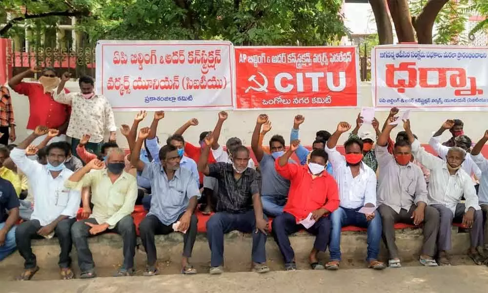 Members of the Building and Other Construction Workers Union protesting at Collectorate in Ongole on Monday