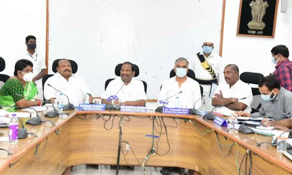 Minister T Harish Rao speaking at a review meeting in Karimnagar on Monday
