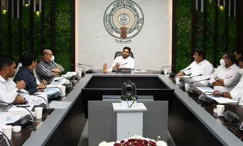 Chief Minister Y S Jagan Mohan Reddy reviews One Time Settlement scheme announced for housing beneficiaries at his camp office in Tadepalli on Monday